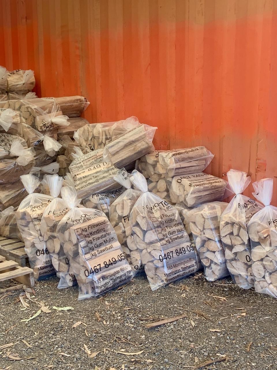 Photo of bagged firewood stacked at the yard